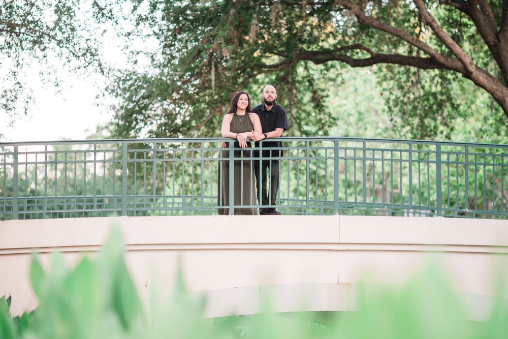Romantic engagement photo on a bridge in Celebration Florida captured by top Orlando photographer