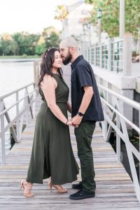 Romantic engagement session on the waterfront dock in Celebration captured by top Orlando wedding photographer