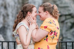 Romantic and fun same-sex engagement session at Disney's Epcot Park captured by top Orlando proposal and engagement photographer