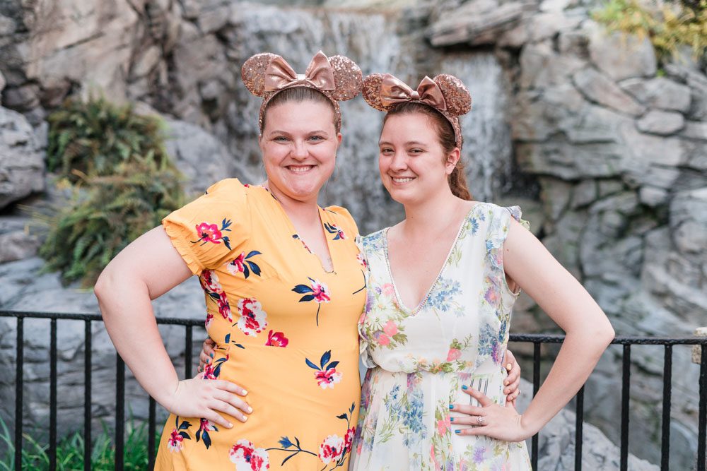 Romantic and fun same-sex engagement session at Disney's Epcot Park captured by top Orlando proposal and engagement photographer