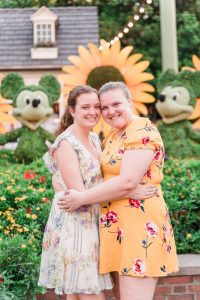 Romantic lesbian engagement session at Disney in Epcot during Flower and Garden Festival captured by top Orlando gay wedding photographer
