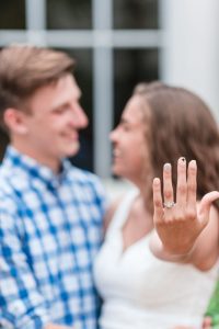 Surprise proposal photography at Disney resort showing off the engagement ring