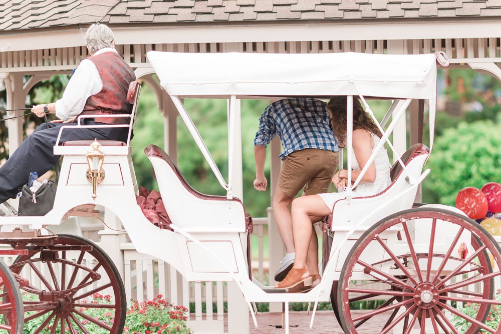 Horse carriage ride turns into a surprise proposal captured by top Orlando engagement photographer at Disney
