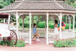 Surprise proposal photography at a gazebo at a Disney resort captured by top Orlando engagement photographer