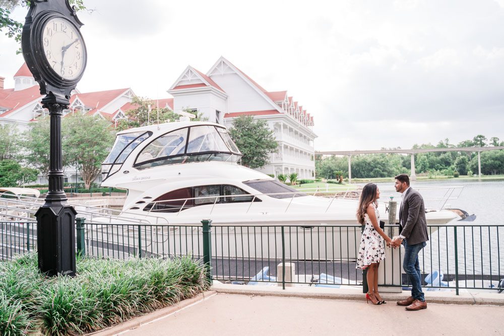 Orlando photographers capture a surprise proposal at the Grand Floridian resort in front of the yacht at Disney