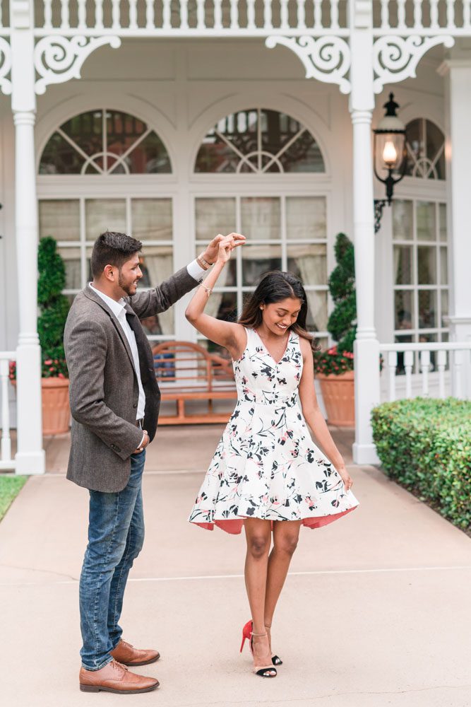 Fun twirling engagement photo at the Grand Floridian captured by top Orlando engagement photographers