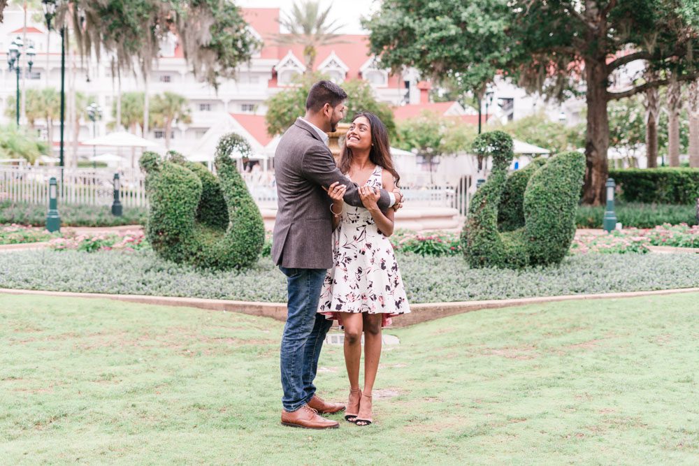 Sweet and romantic engagement portrait at the Grand Floridian following a surprise proposal captured by photographers in Orlando