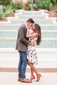 Romantic and fun engagement session photography in front of the fountain at the Grand Floridian Resort in Walt Disney World Orlando
