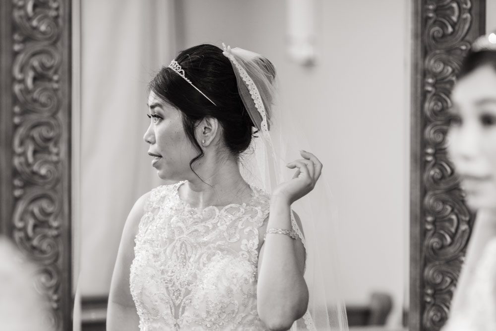 Bride getting ready for her wedding day in Oklahoma captured by photographers from Orlando