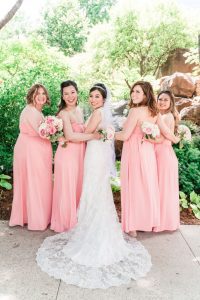 Bridesmaids wearing blush pink dresses with bride at Myriad Gardens in Oklahoma City