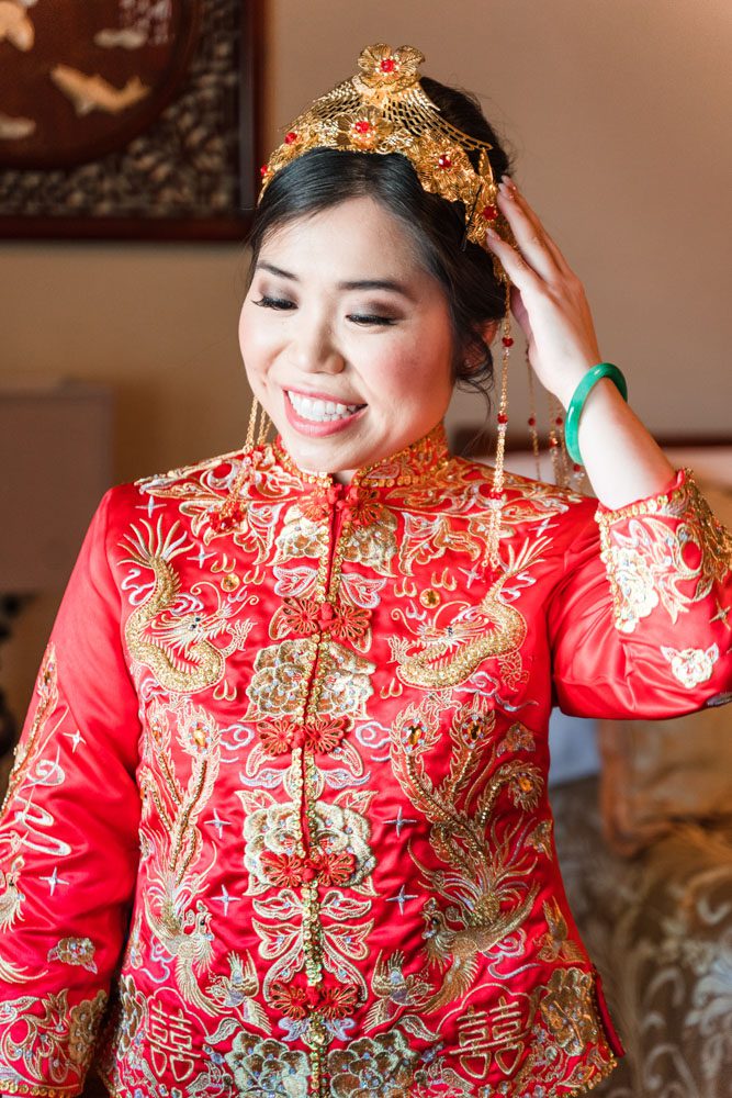 Chinese bride in her traditional Asian attire and headpiece as she prepares for her wedding day in Oklahoma City