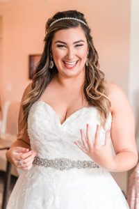 Top Orlando wedding photographer captures bride getting ready for her wedding day at the Crystal Ballroom veranda