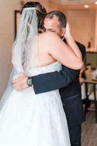 Top Orlando wedding photographer captures bride having a first look with dad for her blush wedding day at the Crystal Ballroom veranda