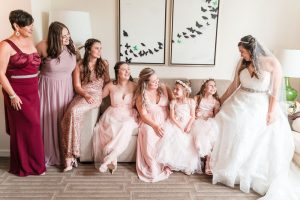 Bride alongside her flower girls and bridesmaids wearing blush pink and gold for her Orlando wedding