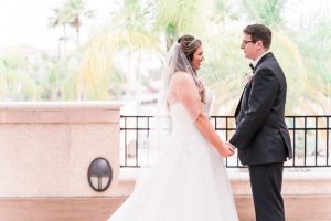 Romantic First look between a bride and groom captured by top Orlando wedding photographer and videographer