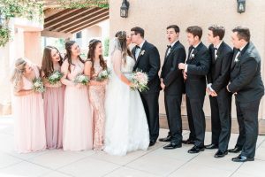 Beautiful and romantic photo of wedding party wearing blush pink during their wedding in Orlando captured by top photographer in Central Florida