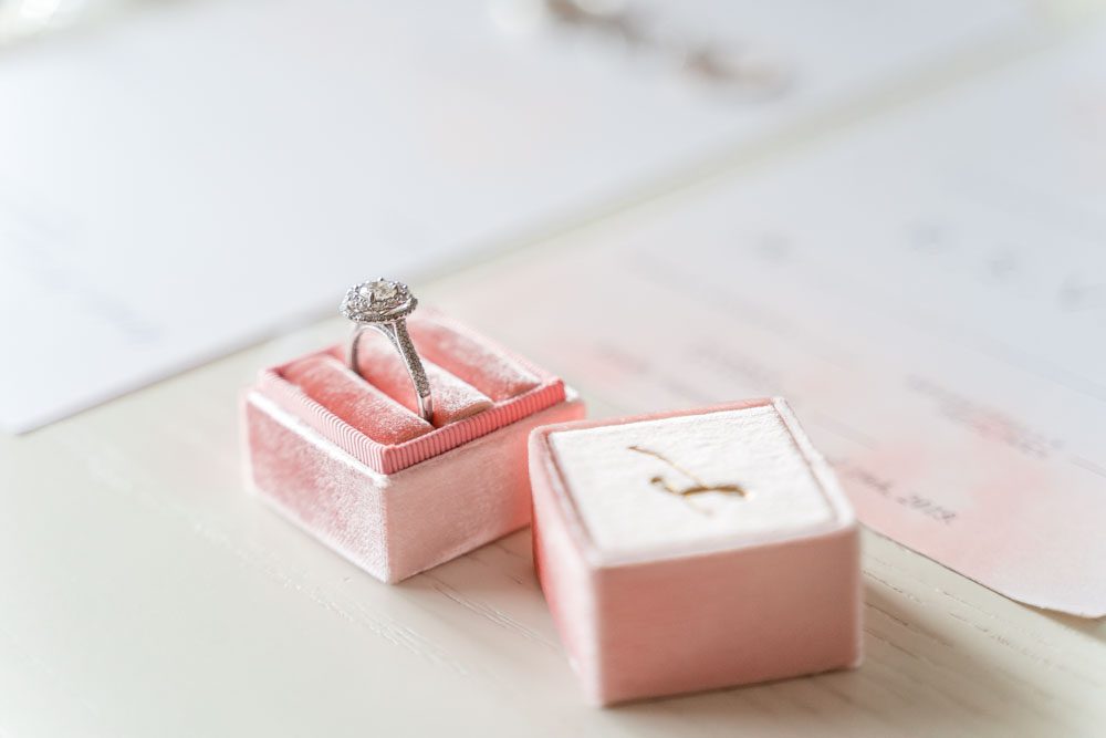 Blush pink ring box with engagement ring captured during Orlando wedding at Crystal Ballroom