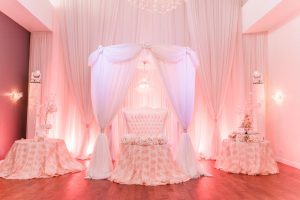 Blush pink, gold and white wedding reception decor at the Crystal Ballroom Veranda captured by top Orlando wedding photographer and videographer