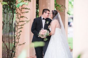 Romantic and candid bride and groom portraits at the Crystal Ballroom Veranda wedding venue captured by top Orlando wedding photographer