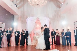 Newlyweds share their first dance at the Crystal Ballroom Veranda wedding venue in Orlando, Florida