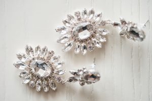 Close up photo of the bride's earrings captured by top Orlando wedding photographer and videographer