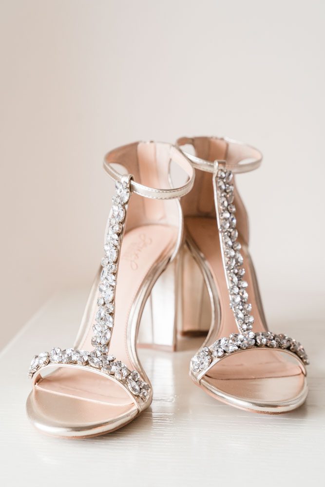 Close up of the brides gold bejeweled wedding heels for her Orlando wedding day at the Crystal Ballroom