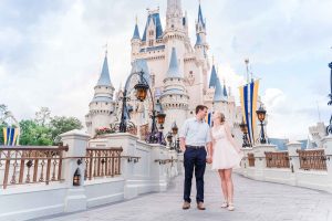 Engagement photo in front of Cinderella Castle in Magic Kingdom Disney World captured by top Orlando photographer