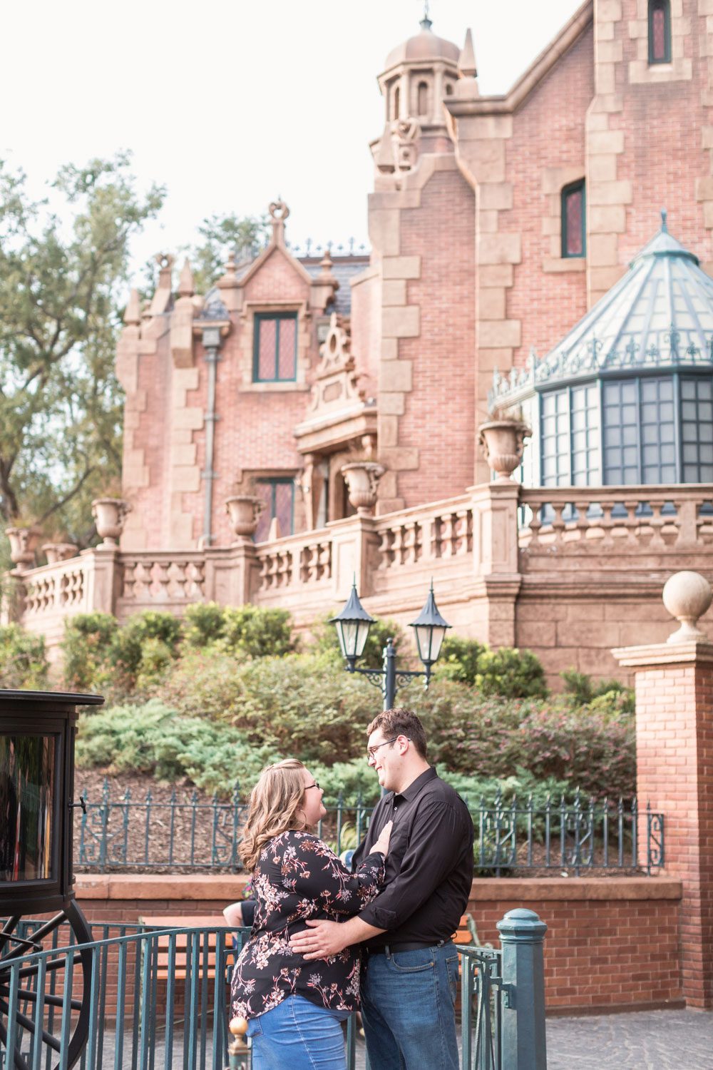 Disney engagement photo in front of the Haunted Mansion at Magic Kingdom in Orlando