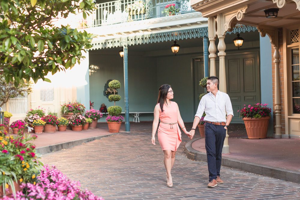 Couple walking in Magic Kingdom during their engagement session at Disney World in Orlando