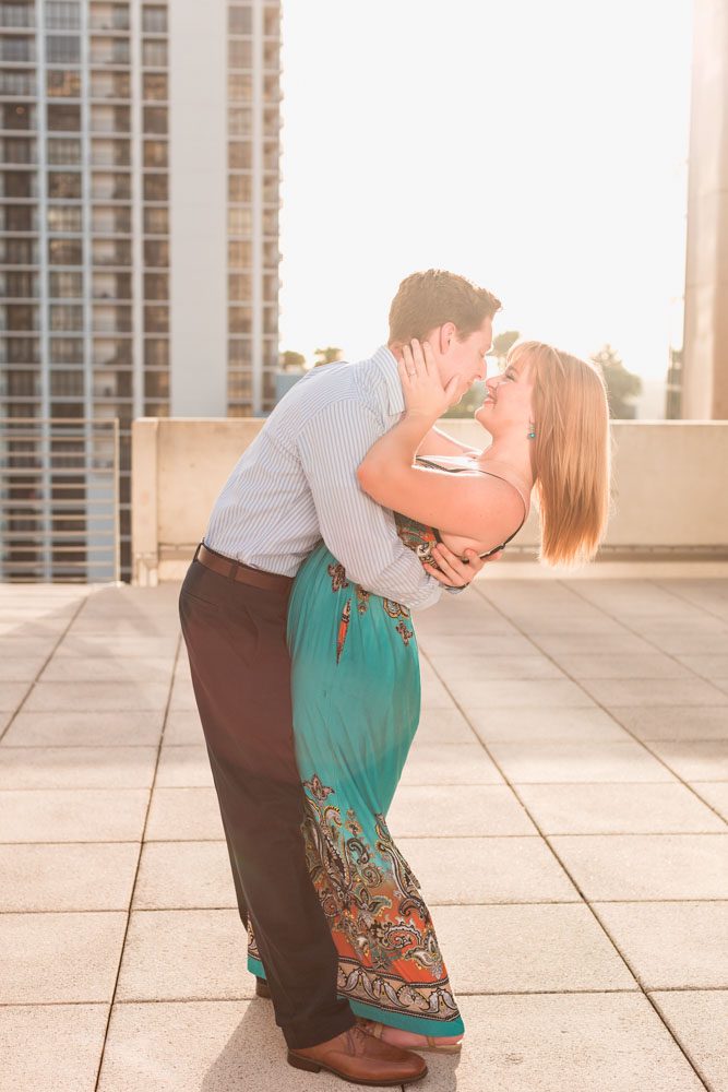 Romantic surprise proposal in Orlando at The Balcony captured by top engagement photographer