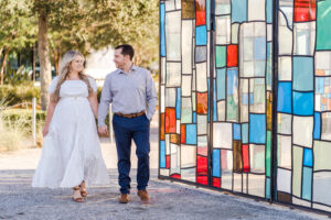 Colorful engagement session at glass house in Lake Nona Laureate park by Orlando photographer
