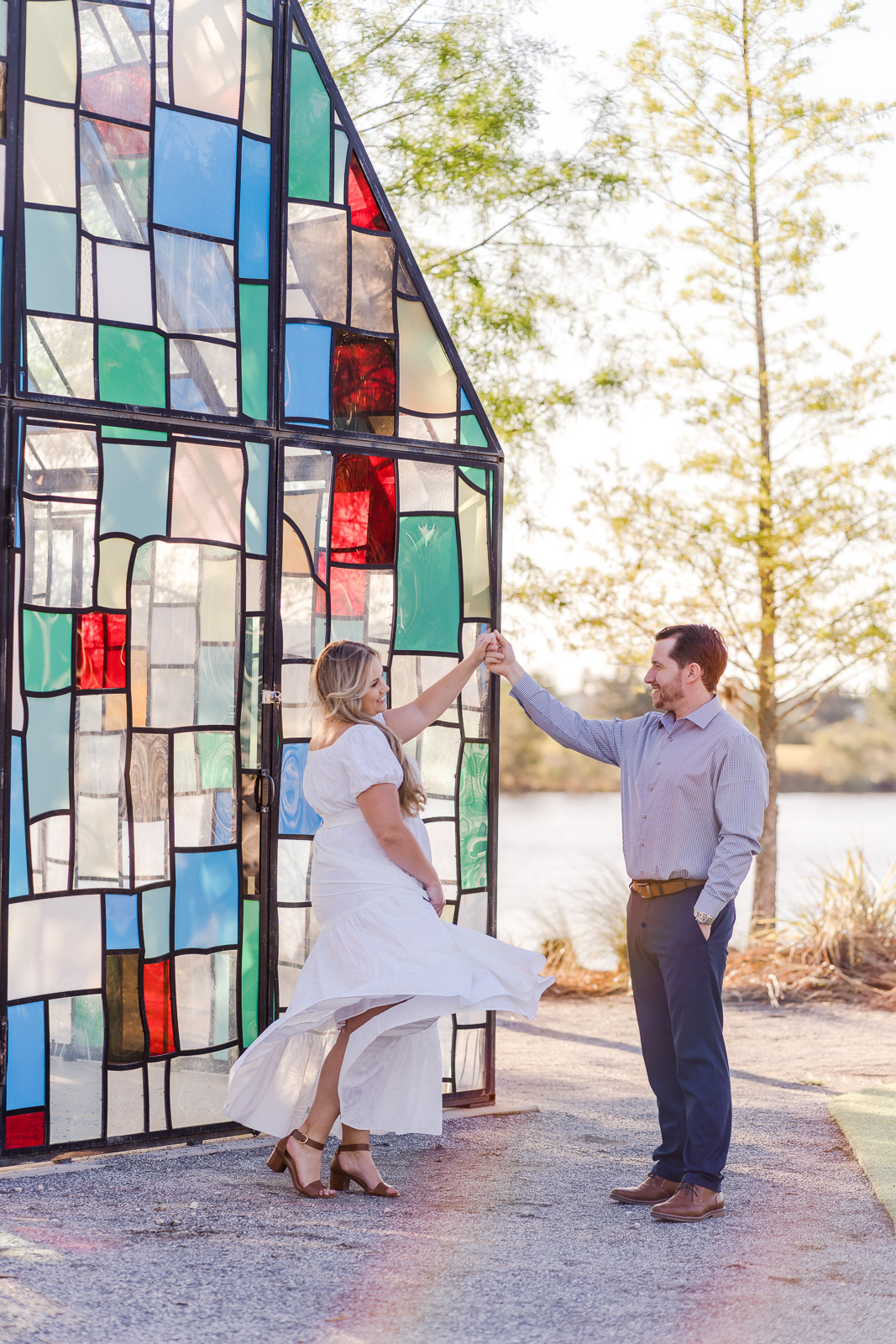 Bride dancing and twirling her dress at a Lake Nona engagement session by top Orlando photographer