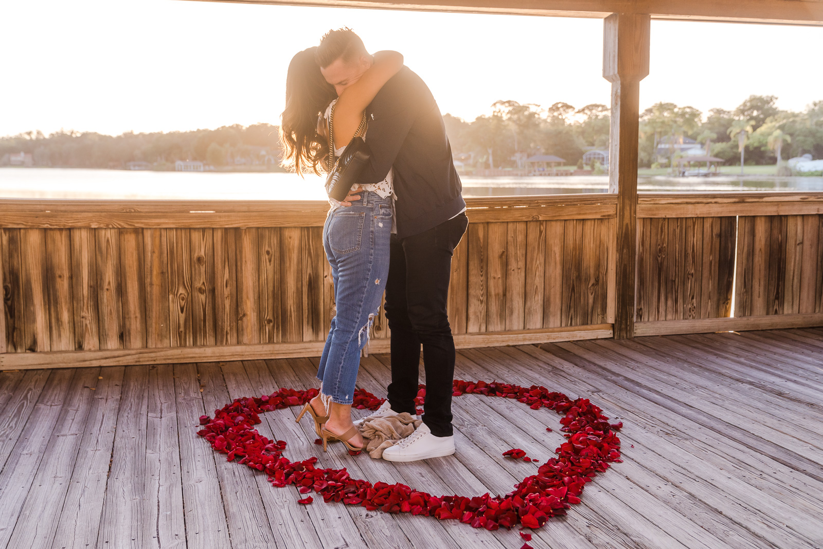 Proposal photographer in Orlando captures romantic sunset engagement at Enzo's on the Lake