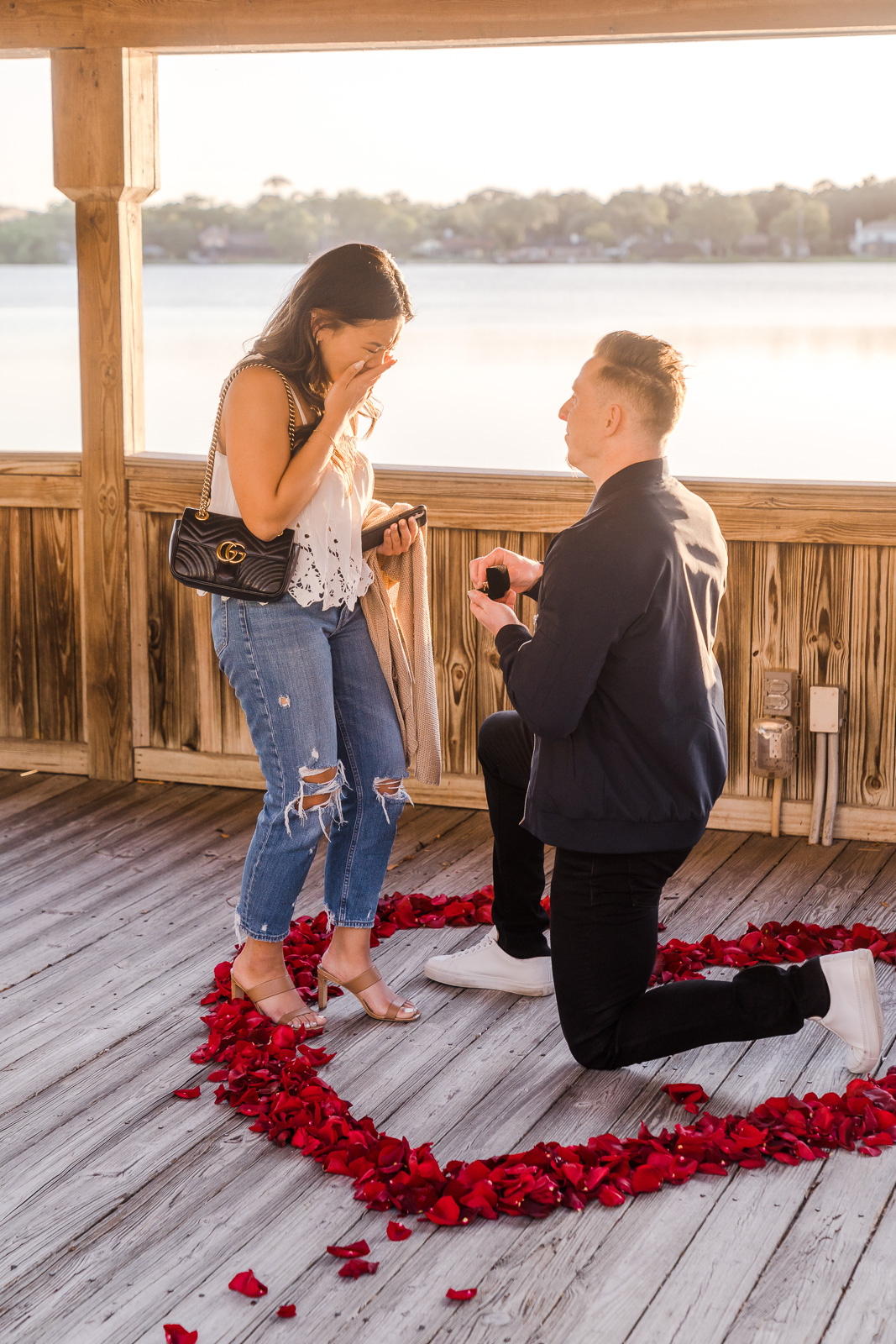 Surprise proposal photographer in Orlando captures engagement at Enzo's on the Lake in central Florida