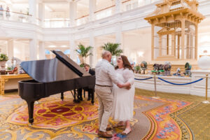 Couple dancing during engagement session at Disney resort by top Orlando photographer at Grand Floridian