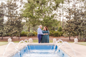 Romantic engagement photo at Disney Port Orleans resort with plus size bride in front of a fountain