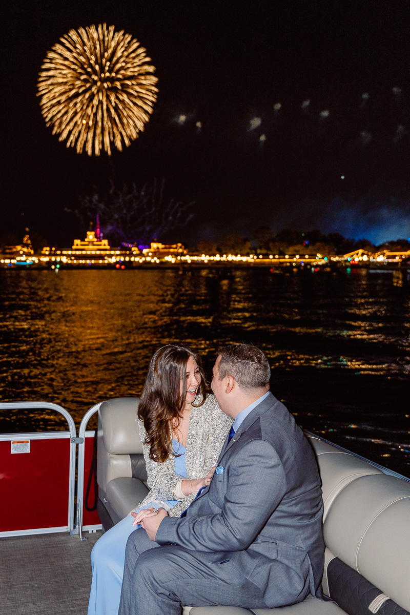 Emotional moment at a surprise proposal with fireworks at Disney World in Orlando, Florida by top engagement photographer