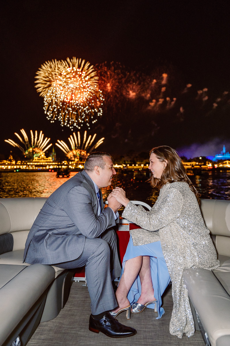 Romantic luxury proposal at Disney World with fireworks captured by top Orlando engagement photographer