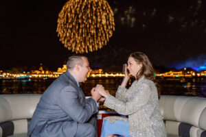 Orlando proposal photographer captures engagement on fireworks boat cruise at night