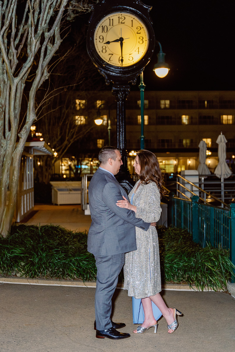 Engagement photography session at night at Grand Floridian marina after fireworks cruise