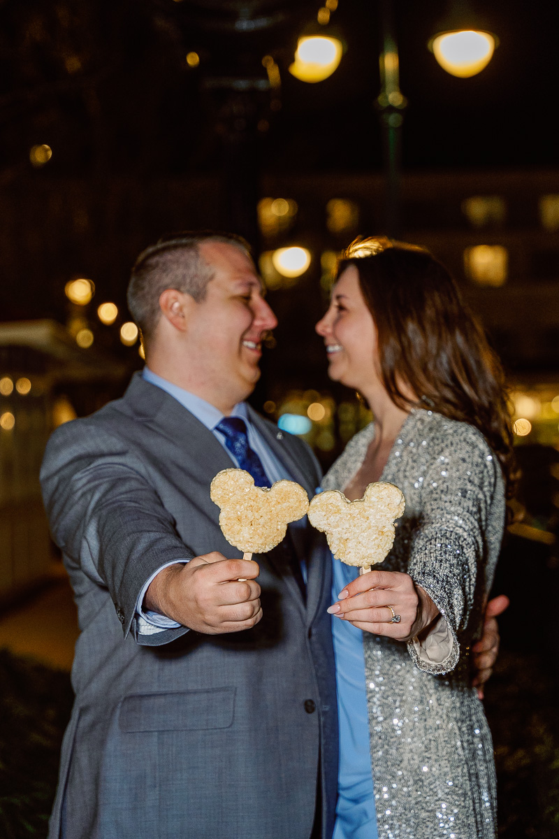Fun Mickey treat photo after engagement session at Grand Floridian after fireworks boat cruise for a surprise proposal