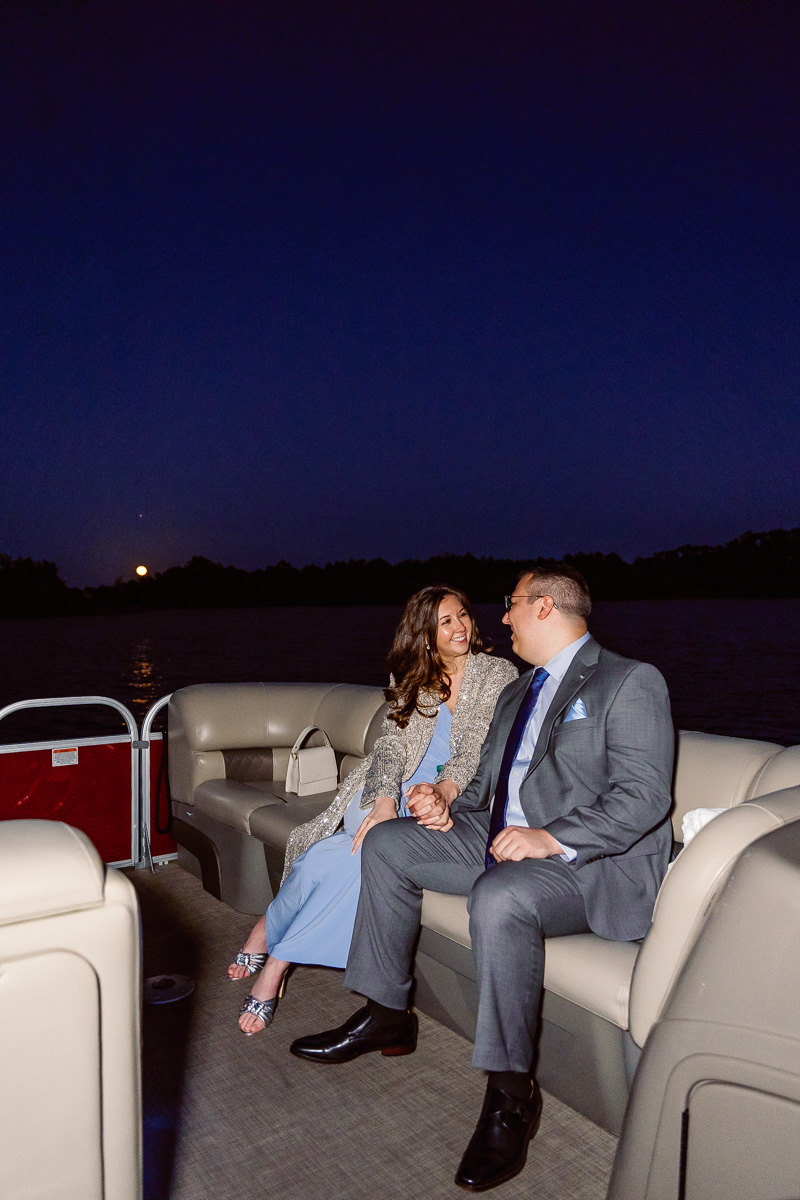 Fireworks boat cruise from Disney's Grand Floridian during a full moon captured by Orlando proposal photographer