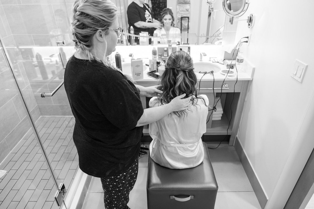 Disney bride getting ready at the Contemporary Resort for her wedding day with top Orlando photographer and videographer Captured by Elle