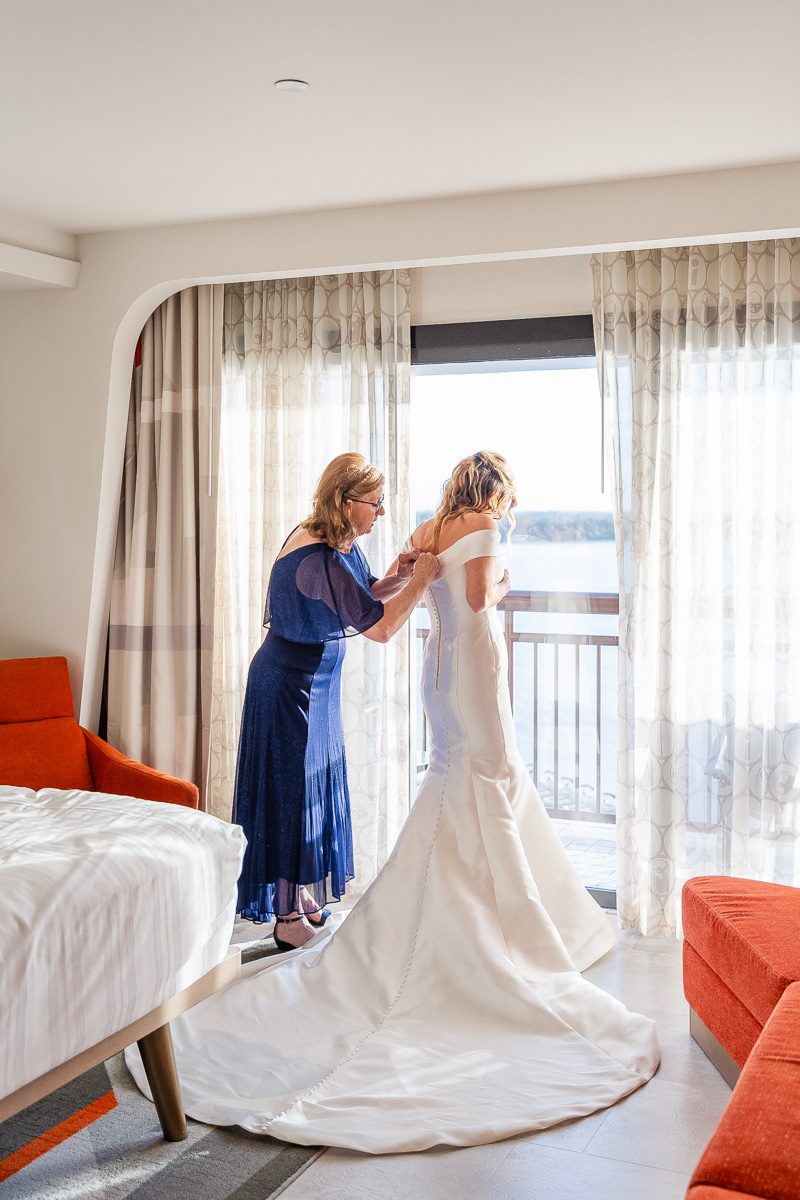 Disney bride getting ready at the Contemporary Resort for her wedding day with top Orlando photographer and videographer Captured by Elle