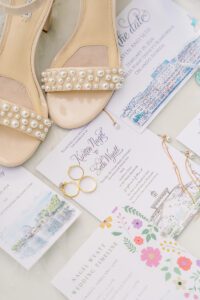 Invitations and bridal details for Disney wedding at the Boardwalk Inn Orlando Florida by top Disney wedding photographer