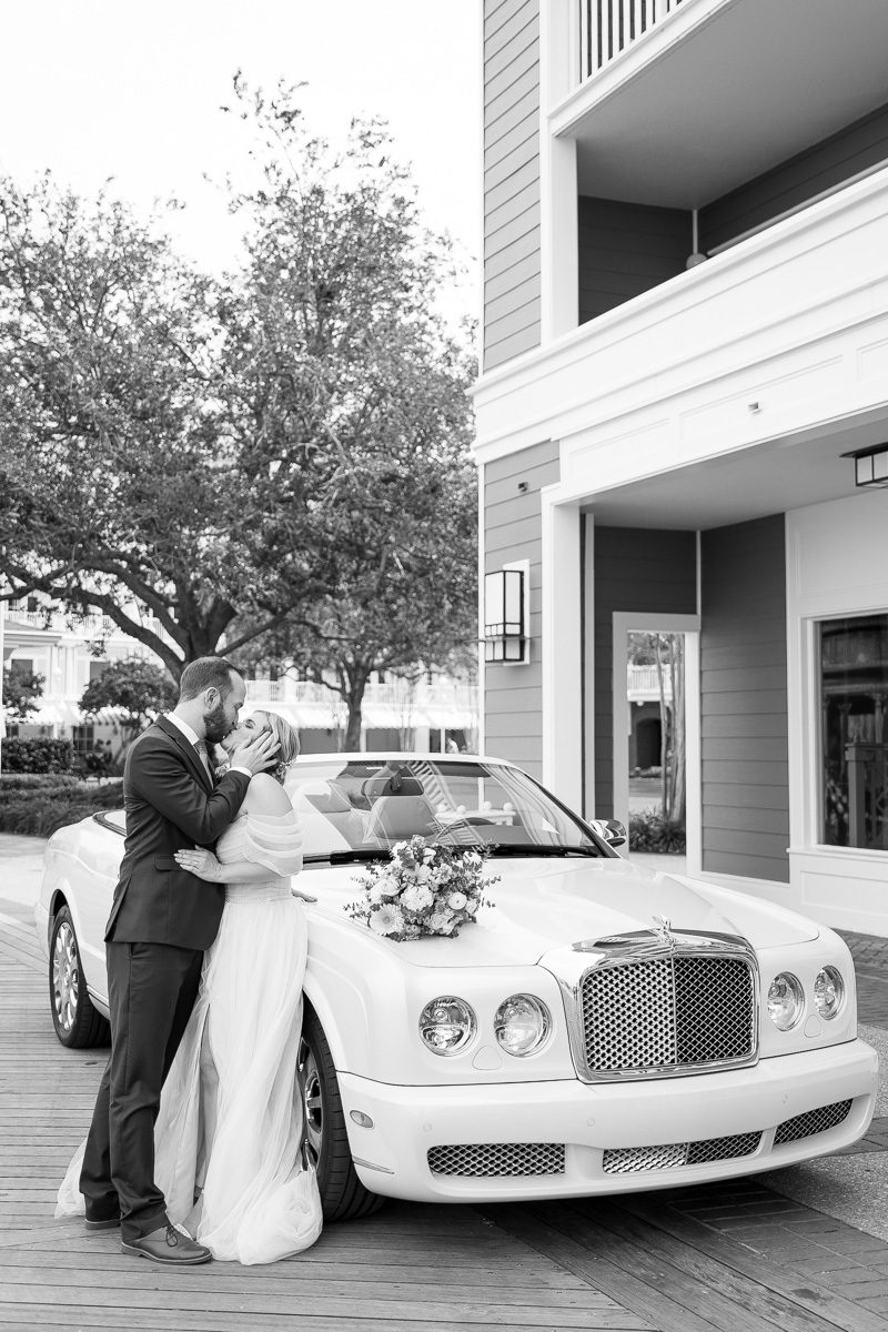 Portrait at Disney's Boardwalk Inn with luxury Bentley convertible car by top Orlando wedding photographer