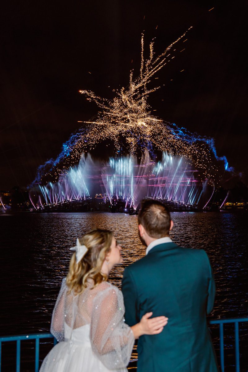 Disney wedding fireworks from Epcot captured by top Orlando wedding photographer at night