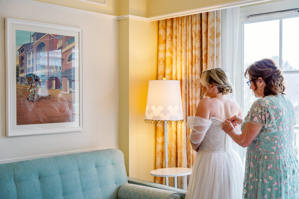 Disney bride gets ready at the Boardwalk Inn for her wedding day with top Orlando photographer and videographer