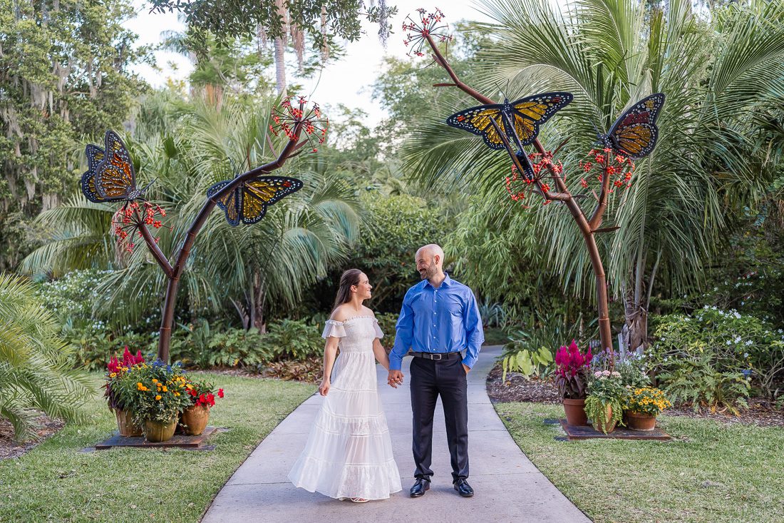 Engagement photography session during butterfly festival at Leu Gardens in Orlando Florida with a butterfly sculpture