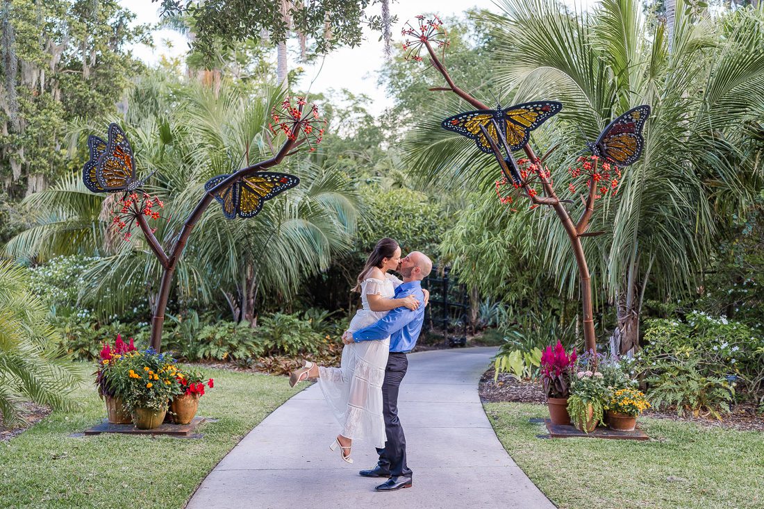 Engagement photography session during butterfly festival at Leu Gardens in Orlando Florida with a butterfly sculpture